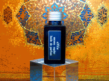 photo of 25ml sapphire blue bottle with silver lid and silver engraved plate of encens saphir