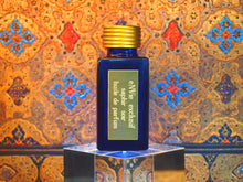 photo of 25ml sapphire blue bottle with gold toned lid and gold engraved plate of saphir soir