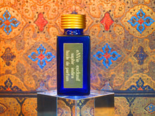 photo of 25ml sapphire blue bottle with gold toned lid and gold engraved plate of saphir indira